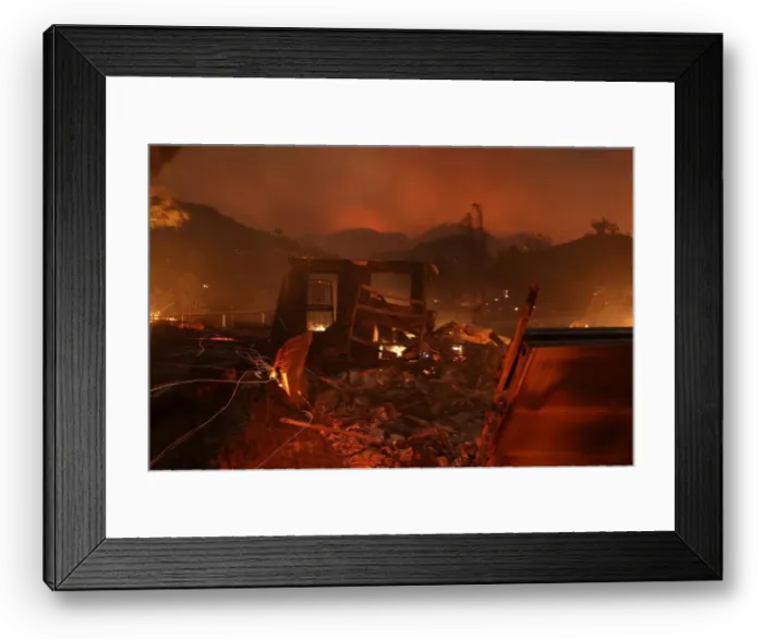 Framed Print : A home burns as strong winds push the Thomas Fire across thousands of acres near Santa