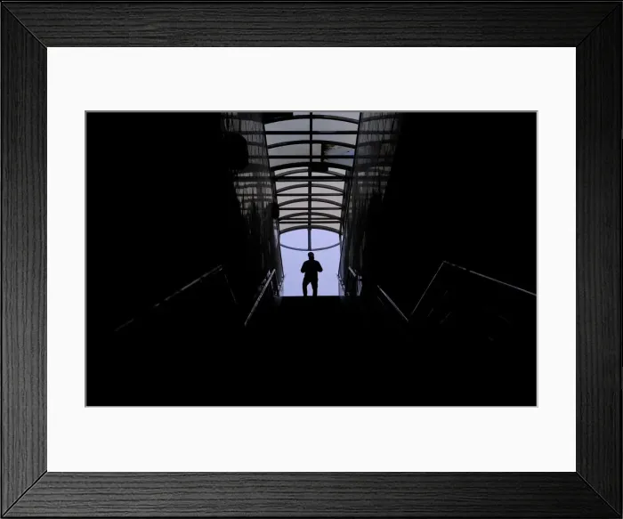 Framed Print : A man walks along a staircase in a pedestrian tunnel in Moscow