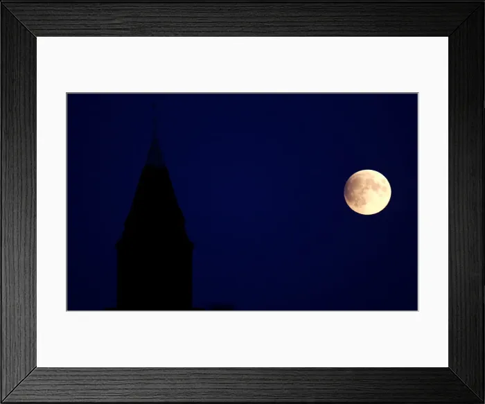 Framed Print : A partial lunar eclipse is seen in Berlin