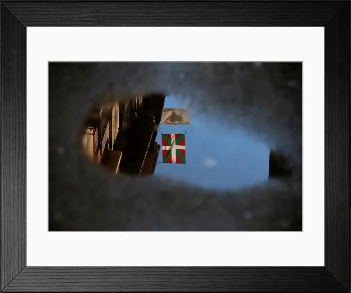 Framed Print : An Ikurrina and a banner that reads, Basque Prisoners to Basque Country