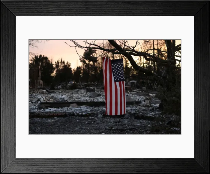 Framed Print : An American flag hangs from a tree in a neighborhood destroyed by wildfire in Santa Rosa Framed Print : An American flag hangs from a tree in a neighborhood destroyed by wildfire in Santa Rosa