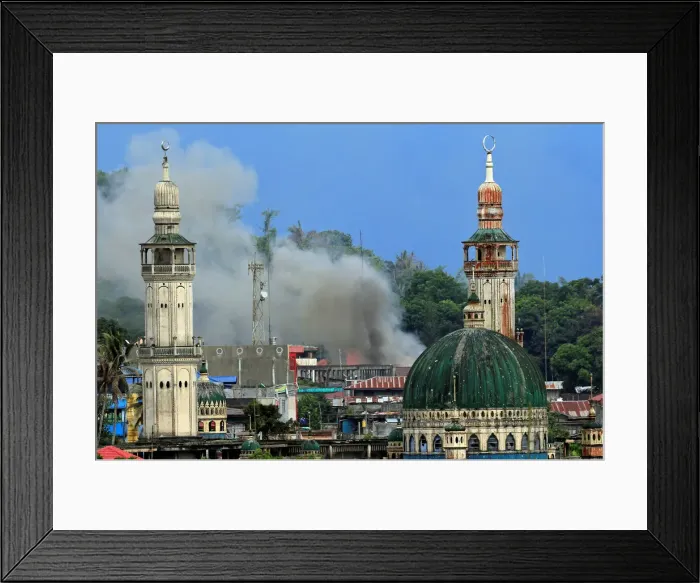 Framed Print : Smoke billows are seen as government troops continue their assault against insurgents Framed Print : Smoke billows are seen as government troops continue their assault against insurgents