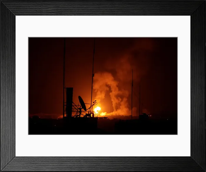 Framed Print : Explosion is seen during Israeli air strikes in Gaza Framed Print : Explosion is seen during Israeli air strikes in Gaza
