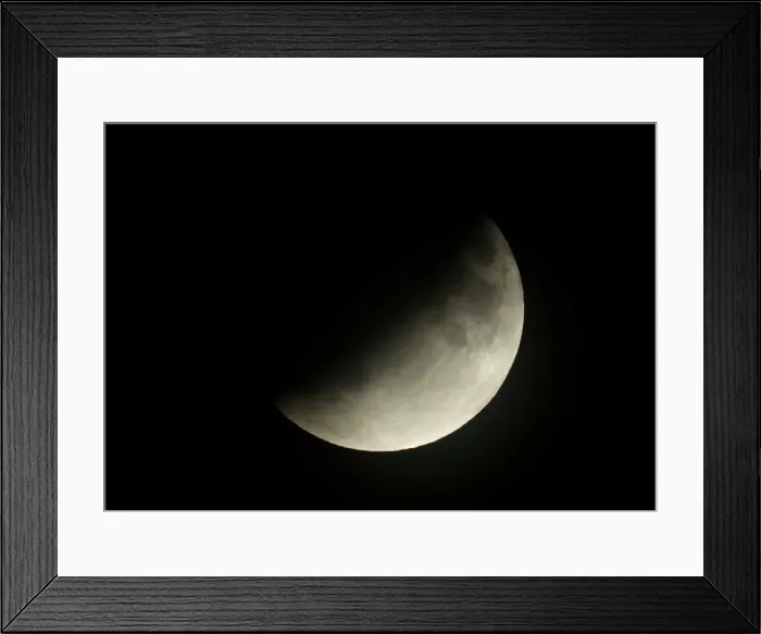 Framed Print : A partial lunar eclipse is seen in Berlin Framed Print : A partial lunar eclipse is seen in Berlin