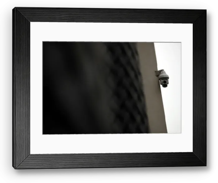 Framed Print : A surveillance camera is seen in the Kings Cross area in London