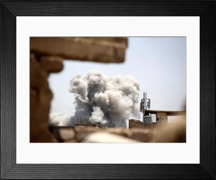 Framed Print : Smoke billows at the position of the Islamic State militants after it was hit by a rocket Framed Print : Smoke billows at the position of the Islamic State militants after it was hit by a rocket