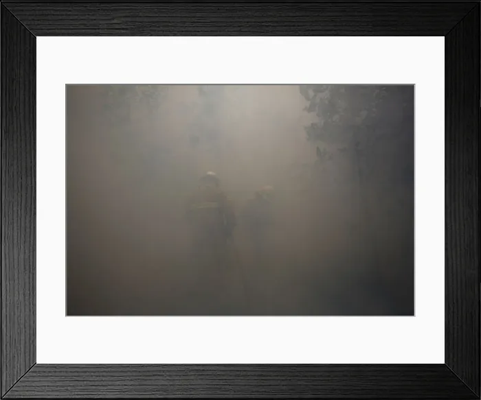 Framed Print : Firefighters work amidst smoke to put out a forest fire near Castanheira de Pera Framed Print : Firefighters work amidst smoke to put out a forest fire near Castanheira de Pera