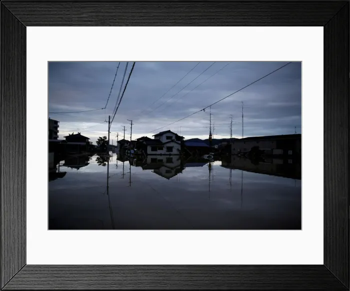 Framed Print : Submerged houses are seen in a flooded area in Mabi town in Kurashiki Framed Print : Submerged houses are seen in a flooded area in Mabi town in Kurashiki