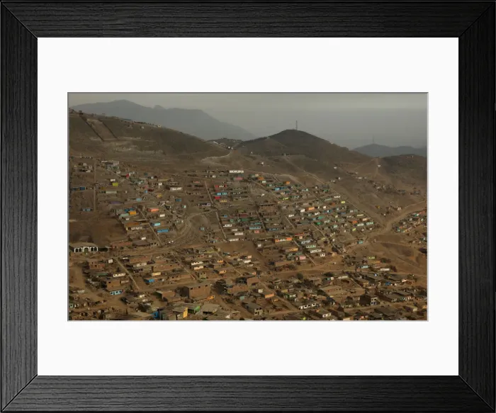 Framed Print : Huts and houses are seen on the hills of Nueva Esperanza ( New Hope Framed Print : Huts and houses are seen on the hills of Nueva Esperanza ( New Hope