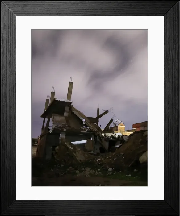 Framed Print : Damaged houses are pictured at night in the rebel-held area, in the city of Daraa, Syria Framed Print : Damaged houses are pictured at night in the rebel-held area, in the city of Daraa, Syria