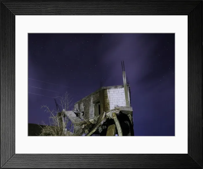 Framed Print : Damaged houses are pictured at night in the rebel-held area, in the city of Daraa, Syria Framed Print : Damaged houses are pictured at night in the rebel-held area, in the city of Daraa, Syria
