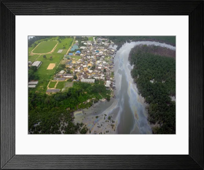 Framed Print : An aerial view shows oil-slicked waterways in the city of Port Harcourt, in Rivers State