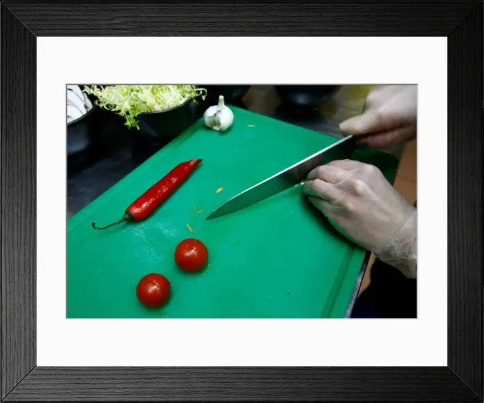 Framed Print : Employee prepares a salad in vegetarian restaurant Green Cuisine in Minsk Framed Print : Employee prepares a salad in vegetarian restaurant Green Cuisine in Minsk
