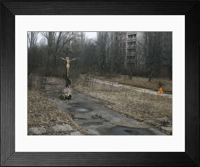 Framed Print : A cross with a crucifix is seen in the deserted town of Pripyat Framed Print : A cross with a crucifix is seen in the deserted town of Pripyat