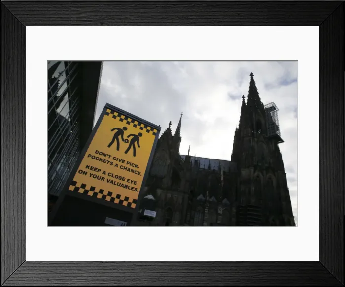 Framed Print : Sign warning against pickpockets is displayed outside main railway station Framed Print : Sign warning against pickpockets is displayed outside main railway station