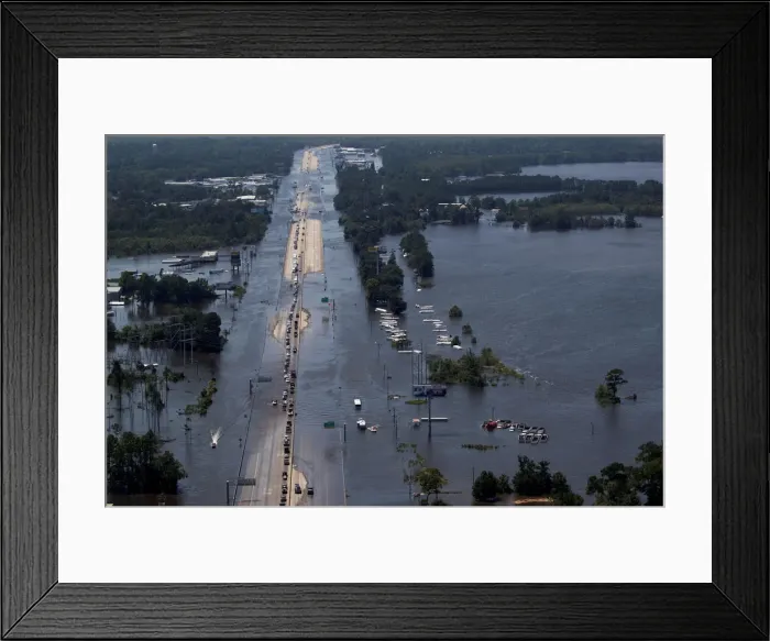 Framed Print : Vehicles on Interstate 10 navigate through flood waters caused by Tropical Storm Harvey Framed Print : Vehicles on Interstate 10 navigate through flood waters caused by Tropical Storm Harvey