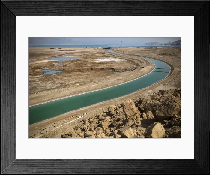 Framed Print : A canal leading to the Dead Sea is seen in Israel Framed Print : A canal leading to the Dead Sea is seen in Israel