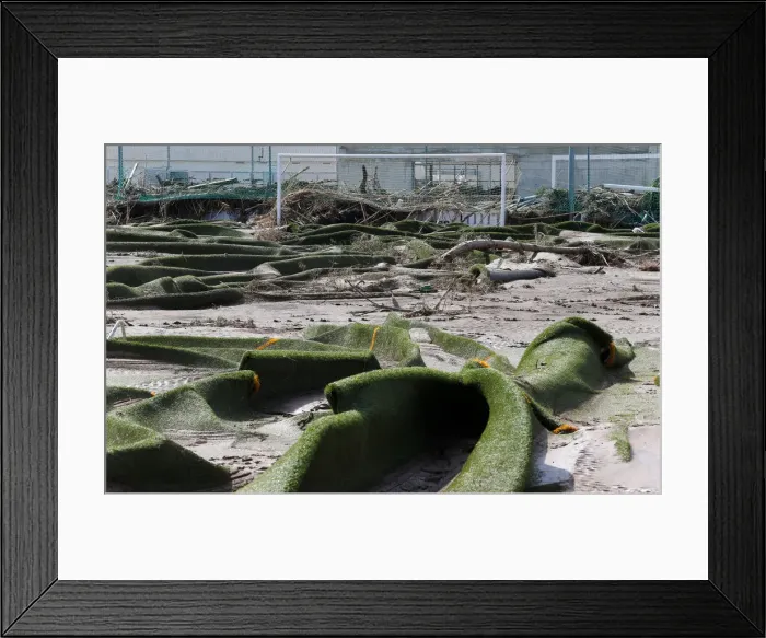 Framed Print : A ravaged local soccer field is seen after heavy rain and flash floods hit Sant Llorenc
