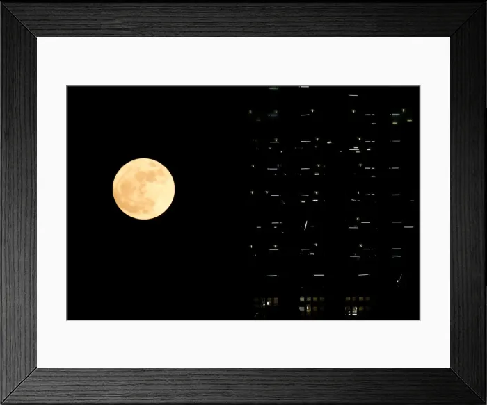Framed Print : The supermoon is seen behind a building under construction in Hong Kong