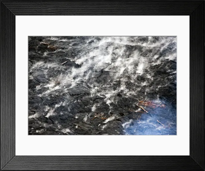 Framed Print : Smoke rises from the lava flow from Mt. Kilauea as it inches closer to the village of