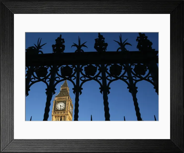 Framed Print : The Big Ben Clock Tower is seen through a gate, in central London