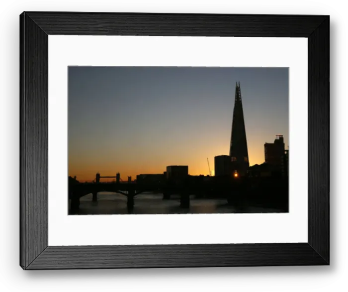 Framed Print : The sun is seen through a window of the Shard building during sunrise in central London Framed Print : The sun is seen through a window of the Shard building during sunrise in central London