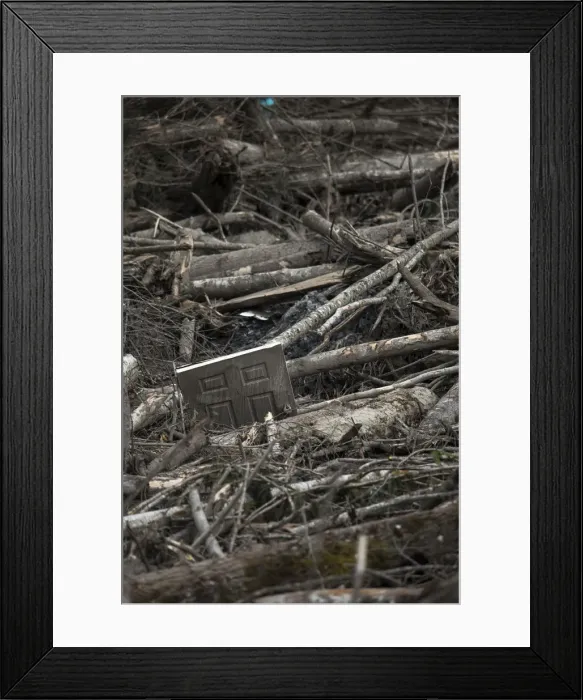 Framed Print : A door is seen trapped amidst a debris field left by a mudslide in Oso Framed Print : A door is seen trapped amidst a debris field left by a mudslide in Oso