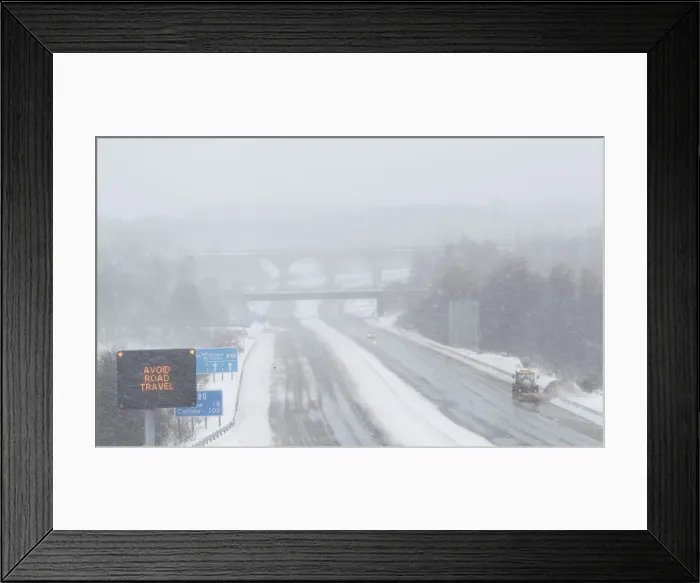 Framed Print : A snowplough works along the M80 motorway, near Castlecary, Scotland Framed Print : A snowplough works along the M80 motorway, near Castlecary, Scotland