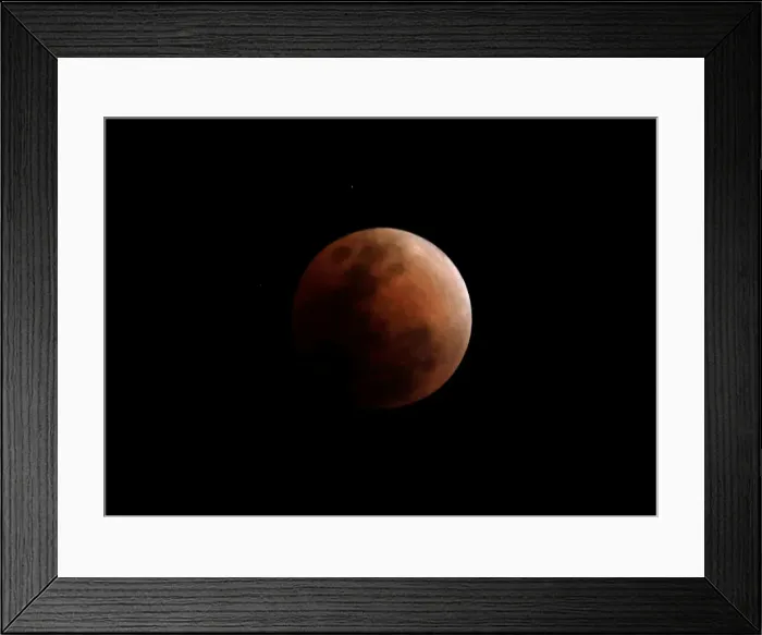 Framed Print : The super blue moon is seen during a total lunar eclipse in Legazpi Framed Print : The super blue moon is seen during a total lunar eclipse in Legazpi