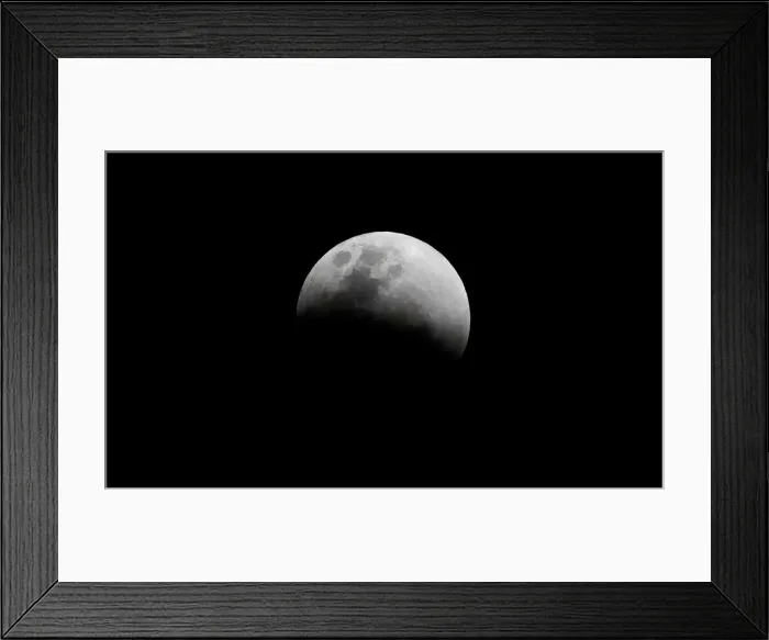 Framed Print : The super blue moon is seen during a total lunar eclipse in Legazpi Framed Print : The super blue moon is seen during a total lunar eclipse in Legazpi