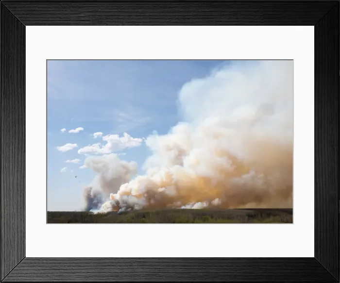 Framed Print : A helicopter flies past thick smoke while battling a major forest fire outside of Fort Framed Print : A helicopter flies past thick smoke while battling a major forest fire outside of Fort