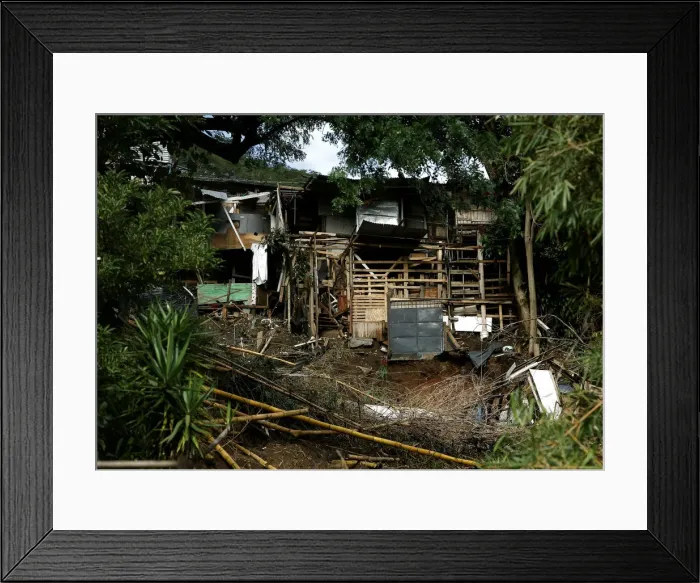 Framed Print : Houses damaged by a mudslide is seen after that the Storm Nate affected the country in
