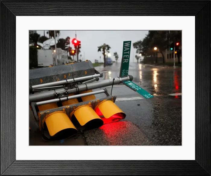 Framed Print : Traffic lights lie on a street after being knocked down Framed Print : Traffic lights lie on a street after being knocked down