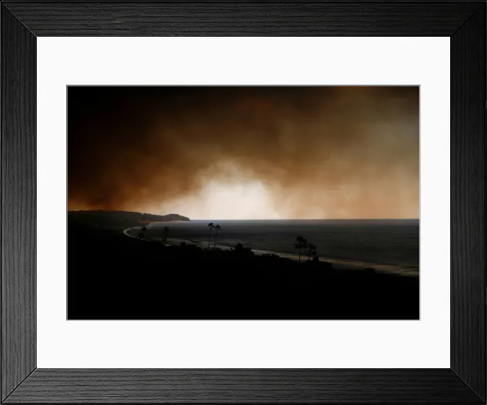 Framed Print : Smoke is seen over the ocean as the Woolsey Fire burns in Malibu