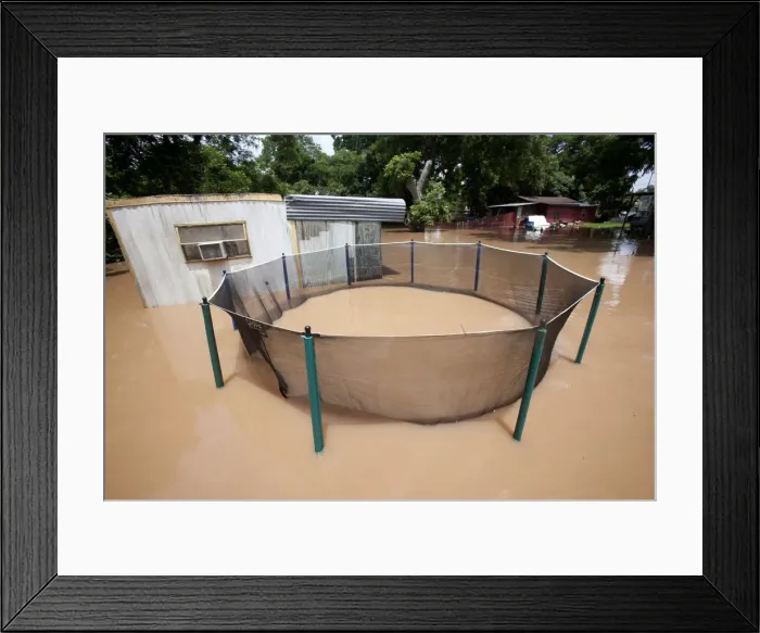 Framed Print : A mobile home park lies flooded after heavy rains in Richmond, Texas Framed Print : A mobile home park lies flooded after heavy rains in Richmond, Texas