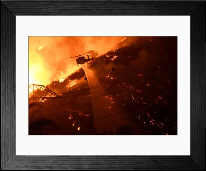 Framed Print : A Los Angeles County fire helicopter makes a night drop while battling the so-called Fish