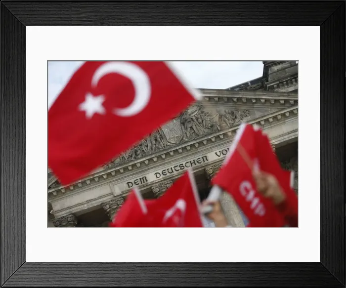 Framed Print : Demonstrators protest against resolution that labels the killings of up to 1