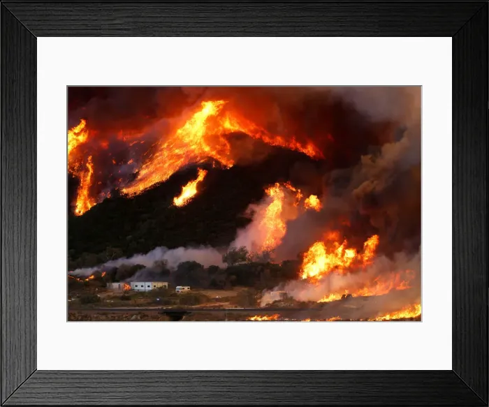 Framed Print : Flames whipped by strong winds burn though a hillside before destroying camper vans Framed Print : Flames whipped by strong winds burn though a hillside before destroying camper vans