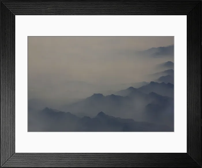 Framed Print : Heavy smog is seen among the mountains from an aircraft Framed Print : Heavy smog is seen among the mountains from an aircraft