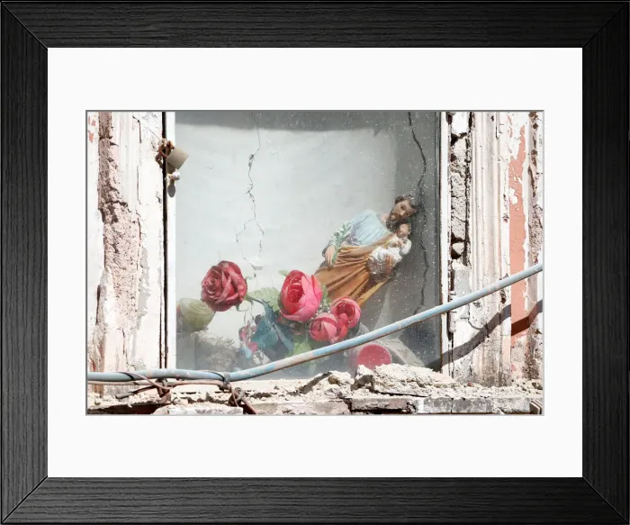 Framed Print : A religious statue slumps to the side after an earthquake hit the island of Ischia Framed Print : A religious statue slumps to the side after an earthquake hit the island of Ischia