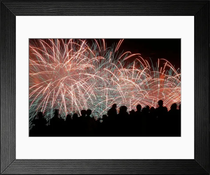 Framed Print : Spectators watch as fireworks explode in the sky as part of celebrations for Victory Day Framed Print : Spectators watch as fireworks explode in the sky as part of celebrations for Victory Day