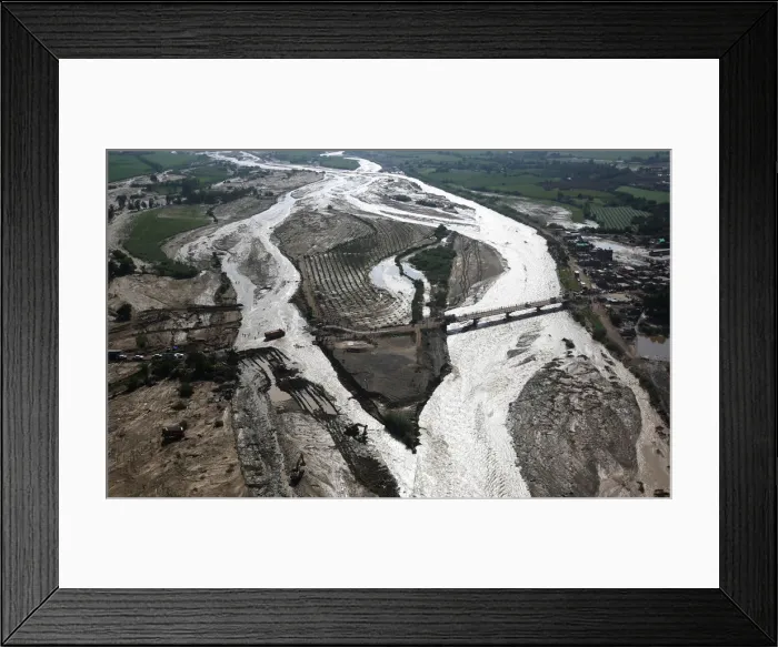 Framed Print : Aerial view of a collapsed road after a massive landslide and flood in Trujillo Framed Print : Aerial view of a collapsed road after a massive landslide and flood in Trujillo