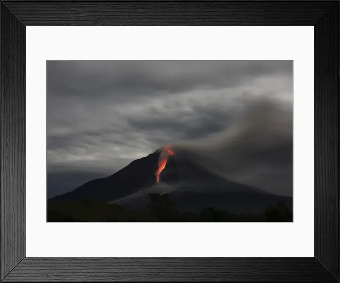 Framed Print : Hot lava spews from Mount Sinabung as seen from Jraya village in Karo district Framed Print : Hot lava spews from Mount Sinabung as seen from Jraya village in Karo district