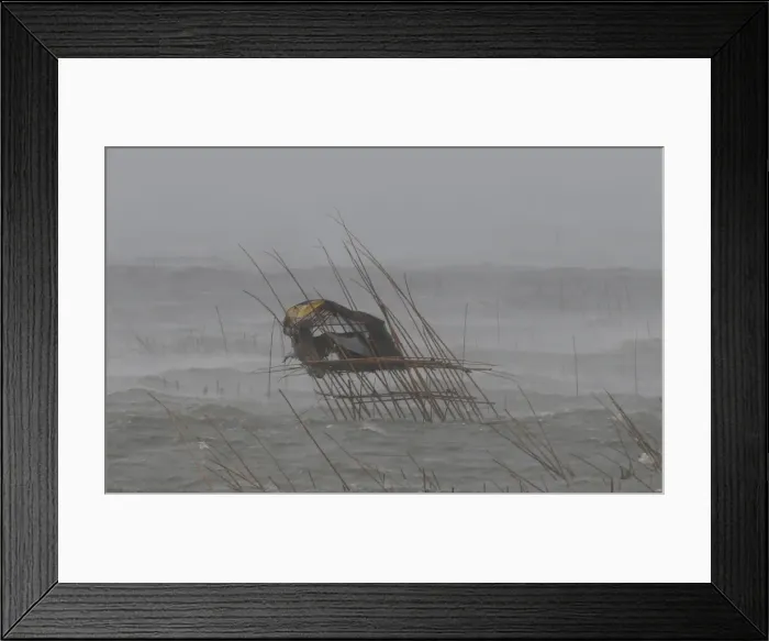 Framed Print : A view of a fishermans house as it is pounded by waves