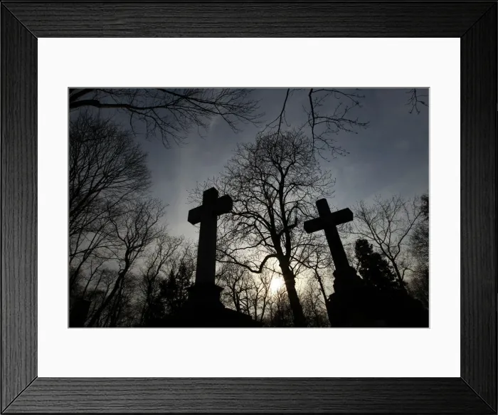 Framed Print : Silhouetted crosses are seen at Powazki cemetery in Warsaw Framed Print : Silhouetted crosses are seen at Powazki cemetery in Warsaw
