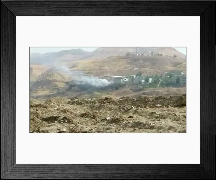 Framed Print : Smoke rises from buildings at the site of a car bomb explosion at a police headquarters Framed Print : Smoke rises from buildings at the site of a car bomb explosion at a police headquarters