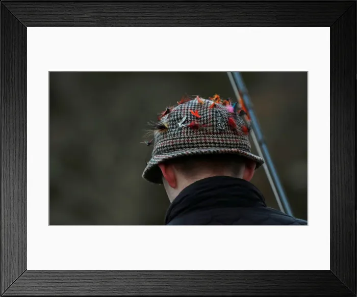 Framed Print : Lures are seen on an anglers hat on the opening day of the salmon fishing season on Framed Print : Lures are seen on an anglers hat on the opening day of the salmon fishing season on