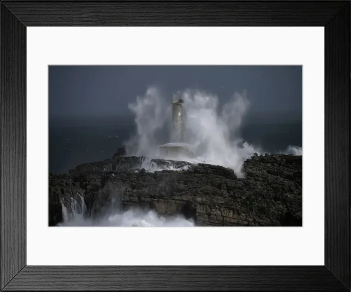 Framed Print : Waves crash on the lighthouse of La Isla del Mouro in the port town of Santander in Framed Print : Waves crash on the lighthouse of La Isla del Mouro in the port town of Santander in