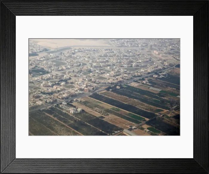 Framed Print : An aerial view of new housing complexes in a suburb of Cairo is pictured through Framed Print : An aerial view of new housing complexes in a suburb of Cairo is pictured through