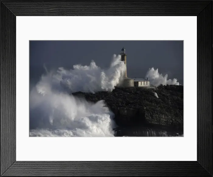Framed Print : Waves crash on the lighthouse of La Isla del Mouro in the port town of Santander in Framed Print : Waves crash on the lighthouse of La Isla del Mouro in the port town of Santander in